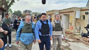Former Arkansas Governor Mike Huckabee (left), MK Danny Danon (center) and former Kansas Governor Sam Brownback (right) at Kibbutz Kfar Aza, Dec. 20, 2023. Credit: Courtesy.
