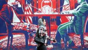 An Iranian woman walks past a mural with anti-American motifs next to the former US embassy in Tehran, Iran, on April 7, 2025. Amid ongoing tensions between Iran and the US, Iranian Foreign Minister Abbas Araghchi stated on April 6, 2025, that there have been no negotiations between Iran and the US. EPA-EFE/ABEDIN TAHERKENAREH