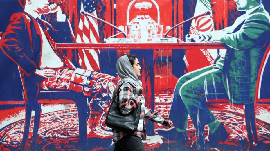An Iranian woman walks past a mural with anti-American motifs next to the former US embassy in Tehran, Iran, on April 7, 2025. Amid ongoing tensions between Iran and the US, Iranian Foreign Minister Abbas Araghchi stated on April 6, 2025, that there have been no negotiations between Iran and the US. EPA-EFE/ABEDIN TAHERKENAREH