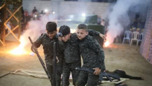 Children affiliated with Hamas in Gaza City act out the breaking through of the border with Israel and taking over a military post on Sept. 1, 2019. Photo by Hassan Jedi/Flash90.