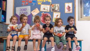 Children learn about the customs of Rosh Hashanah ahead of the Jewish New Year at a kindergarten in Moshav Yashresh in central Israel, Oct. 1, 2024. Photo by Yossi Aloni/Flash90.
