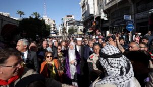 Palestinians scouts share the Holy Fire in the city of Ramallah, in the West Bank, as Orthodox Christians mark the Holy Saturday, a day ahead of the Easter holiday, April 15, 2023. Photo by Flash90.