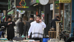 Ultra-Orthodox Jews seen walking on a street in Borough Park neighborhood in the southwestern borough of Brooklyn, New York City on January 12, 2025. Photo by Arie Leib Abrams/Flash90