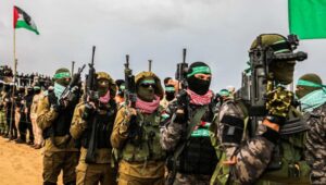 Hamas terrorists hand over the bodies of four Israeli hostages to the Red Cross in Khan Yunis on February 20, 2025. Photo by Abed Rahim Khatib/Flash90.