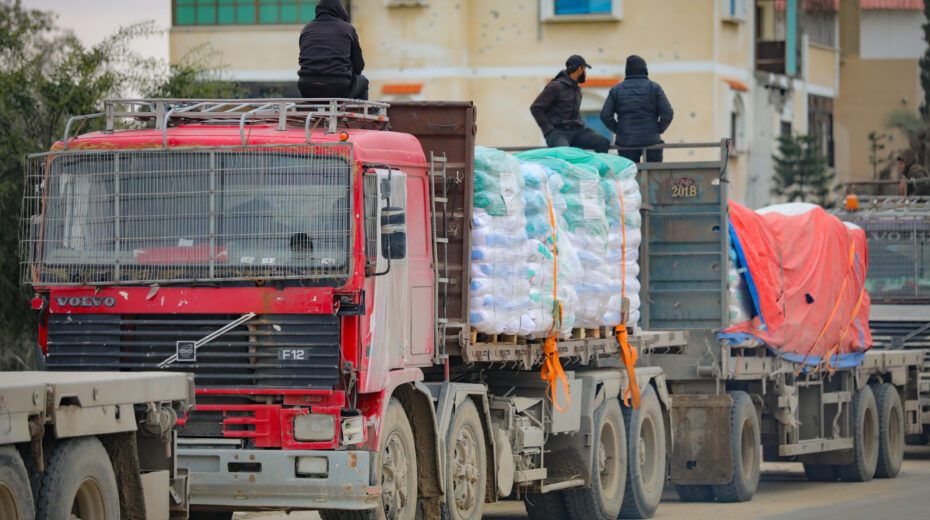 Palestinian trucks carrying humanitarian aid pass the Kerem Shalom border crossing east of the city of Rafah in the southern Gaza Strip on February 24, 2025, en route to Gaza. Photo: Ali Hassan/Flash90