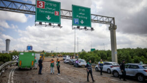 Israeli security forces at the site where a missile fired from Yemen landed near Ben Gurion Airport on May 4, 2025. Photo: Chaim Goldberg/Flash90