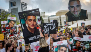 Israelis watch the release of Israeli/US hostage Edan Alexander, at Hostage Square in Tel Aviv, May 12, 2025. Photo by Chaim Goldberg/Flash90