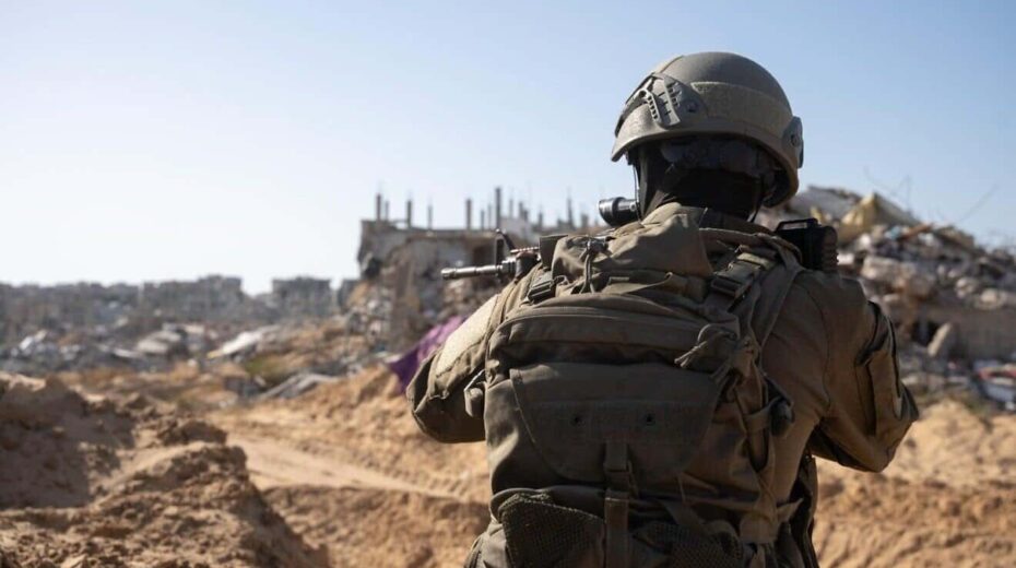 IDF soldier seen in an unknown location in the Gaza Strip, in front of rubble and ruin. Credit: IDF.