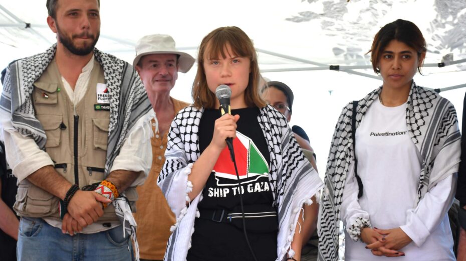 Swedish climate activist Greta Thunberg (center) during a press conference with the crew of the Madleen, the sailing ship of the NGO Freedom Flotilla, before departing from the port of San Giovanni Li Cuti towards Gaza, in Catania, Italy, on June 1, 2025. Photo: EPA-EFE/ORIETTA SCARDINO