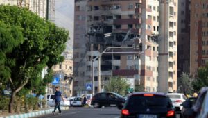 View of a building hit by Israeli airstrikes north of Tehran, Iran, on June 13, 2025. Photo: EPA-EFE/ABEDIN TAHERKENAREH