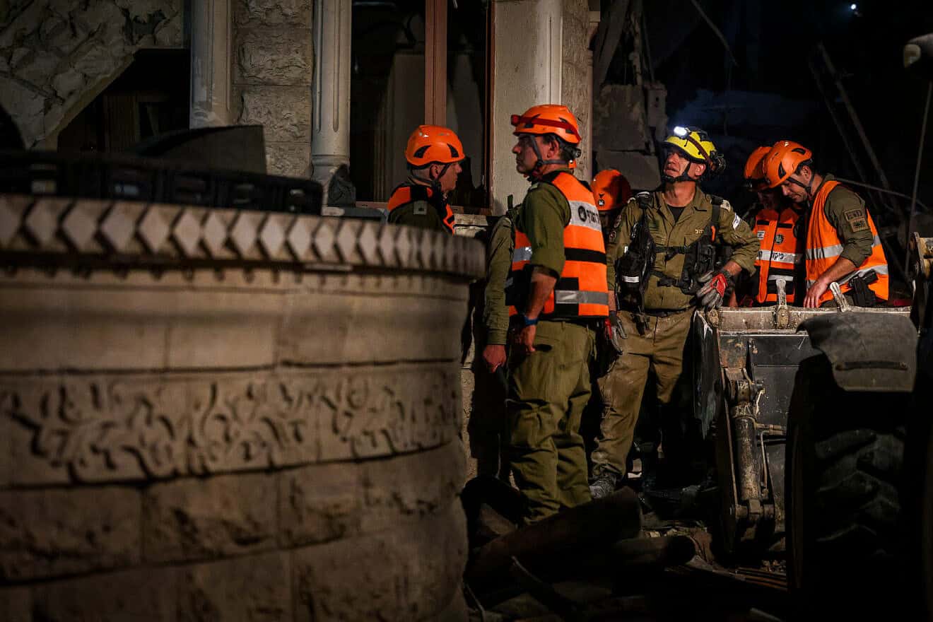 Israeli security and rescue forces at the scene where a ballistic missile fired from Iran hit and caused damage in Tamra, June 14, 2025. Photo by David Cohen/Flash90.