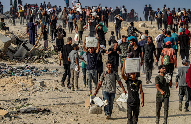 Palestinians gather at near the Zikim border crossing between Israel and Beit Lahia in the northern Gaza Strip, to access humanitarian aid entering through the Zikim crossing, June 23, 2025. Photo by Ali Hassan/Flash90