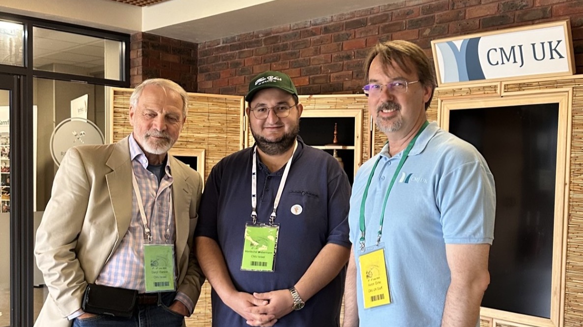 Mordechai Veberman (center) and Rev. Aaron Eime (right) at the CMJ conference. Photo: Charles Gardner