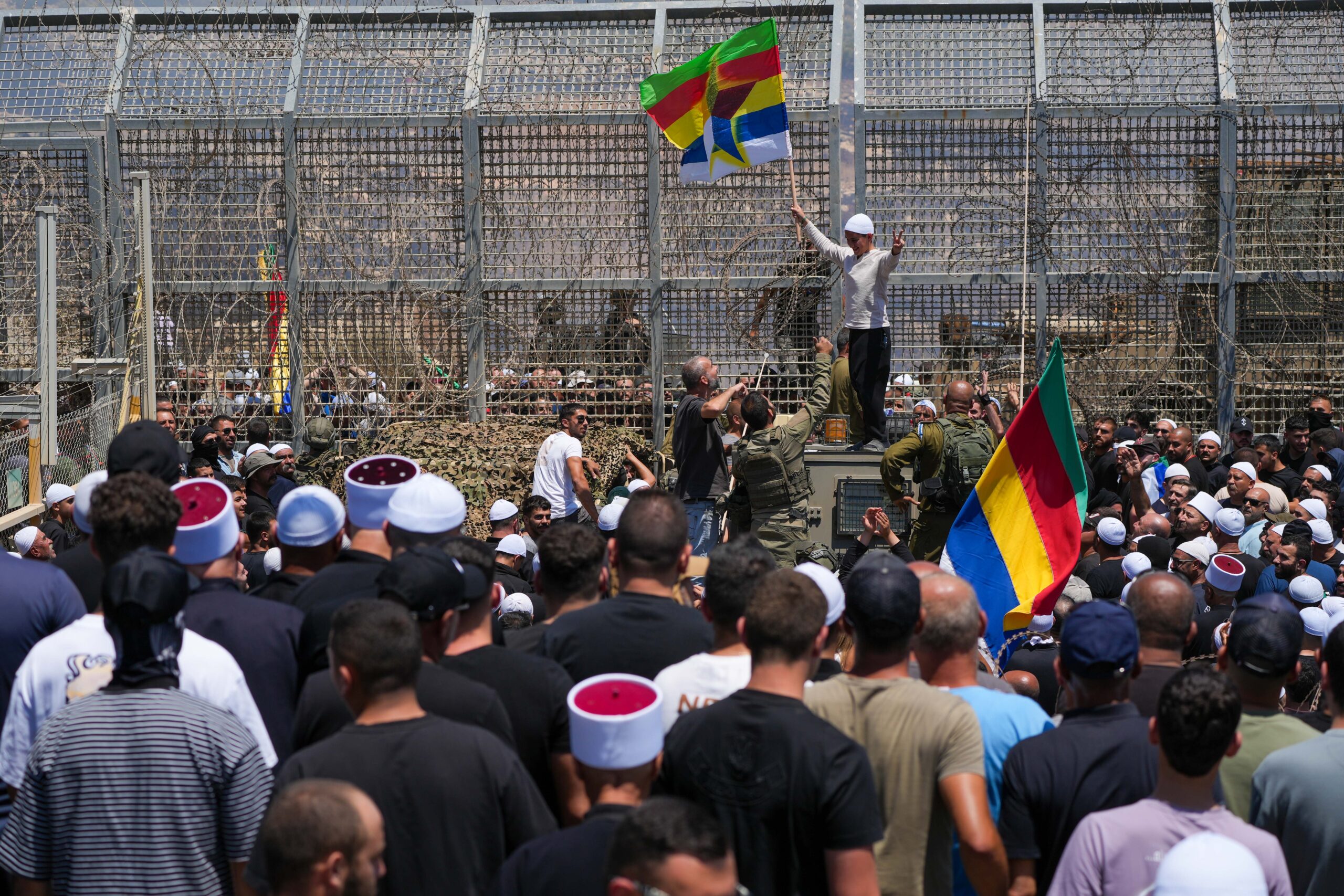 Druze protest in solidarity with their community in Syria near the Israeli-Syrian border fence in Majdal Shams on July 16, 2025. Photo: Ayal Margolin/Flash90