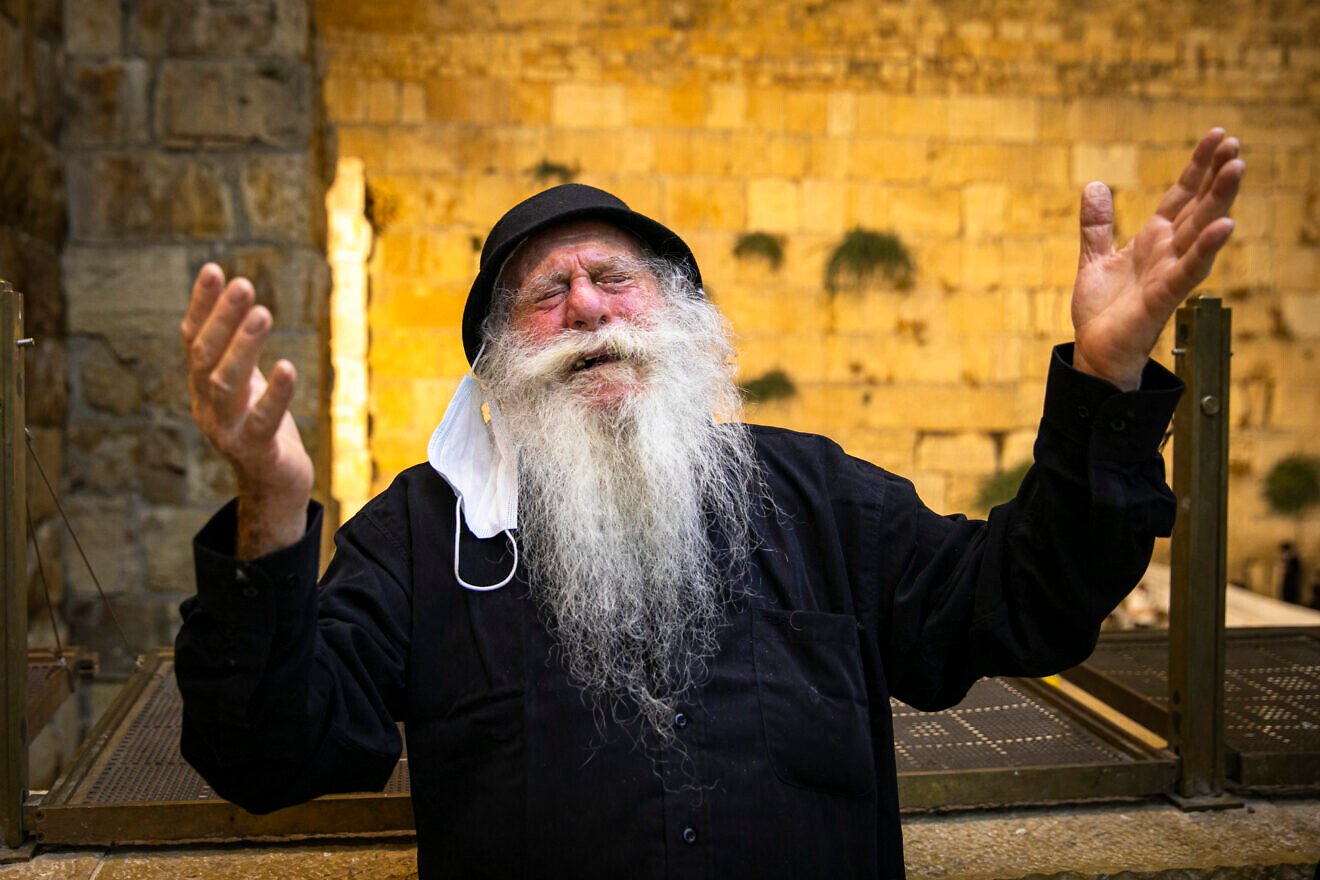 An elderly Jewish man prays at the Western Wall on the eve of Tisha B’Av in the Old City of Jerusalem, on July 29, 2020. Photo by Olivier Fitoussi/Flash90.