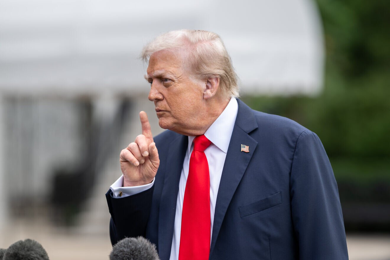 U.S. President Donald Trump departs the White House and gaggles with the press on the South Lawn before boarding HMX-1 to begin traveling to the United Kingdom on Sept. 15, 2025. Credit: Harrison Koeppel/White House.