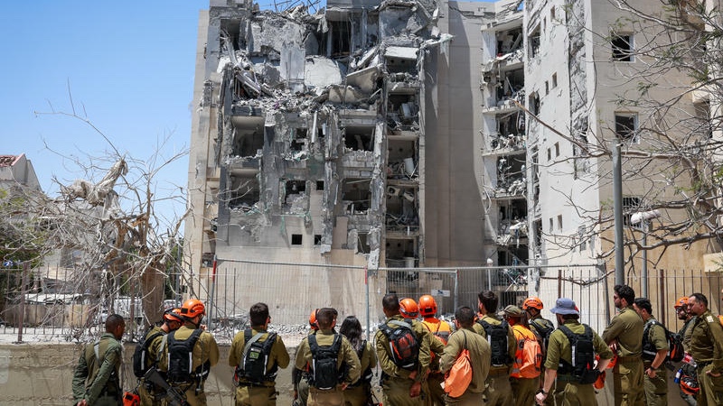IDF search and rescue teams survey the damage caused by an Iranian ballistic missile to a residential building in Beersheva on June 24, 2025. Photo by David Cohen/Flash90
