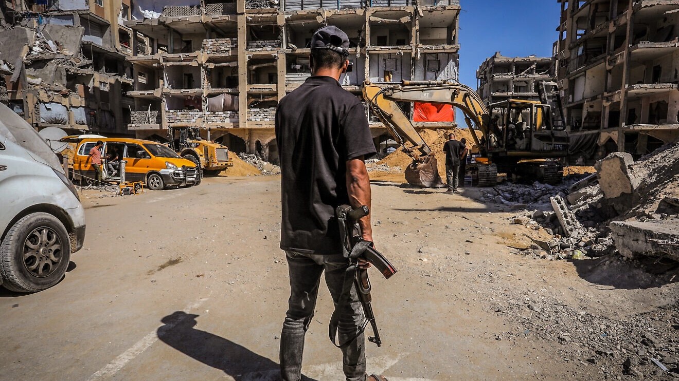 Hamas uses bulldozers to search for the bodies of Israeli hostages who were held in Khan Yunis, in the southern part of the Gaza Strip, Oct. 18, 2025. Photo by Saeed Mohammed/Flash90.