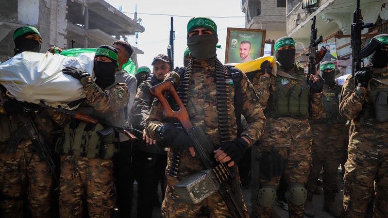 Members of the Al-Qassam Brigades, the military wing of Hamas and mourners attend the funeral of Al-Qassam fighters who were killed during the war between Israel and Hamas in the Al-Shati camp, in Gaza City, February 28, 2025. Photo by Khalil Kahlout/Flash90