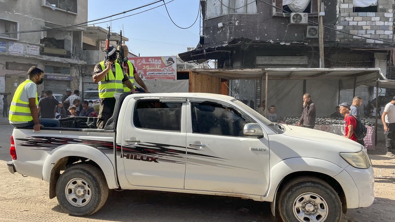 Masked Palestinian gunmen seize control of trucks carrying aid entering the southern Gaza Strip through the Kerem Shalom crossing, on October 11, 2025. Photo by Saeed Mohammed/Flash90