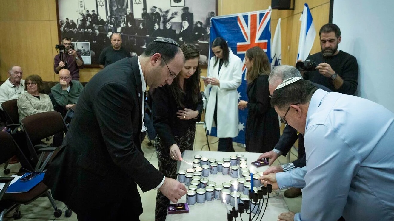 People attend a ceremony, held at the World Zionist Organization (WZO) building in downtown Jerusalem, in memory of victims of a mass shooting on Dec. 14 during a Chanukah celebration on Bondi Beach in Australia, Dec. 15, 2025. Photo by Chaim Goldberg/Flash90.