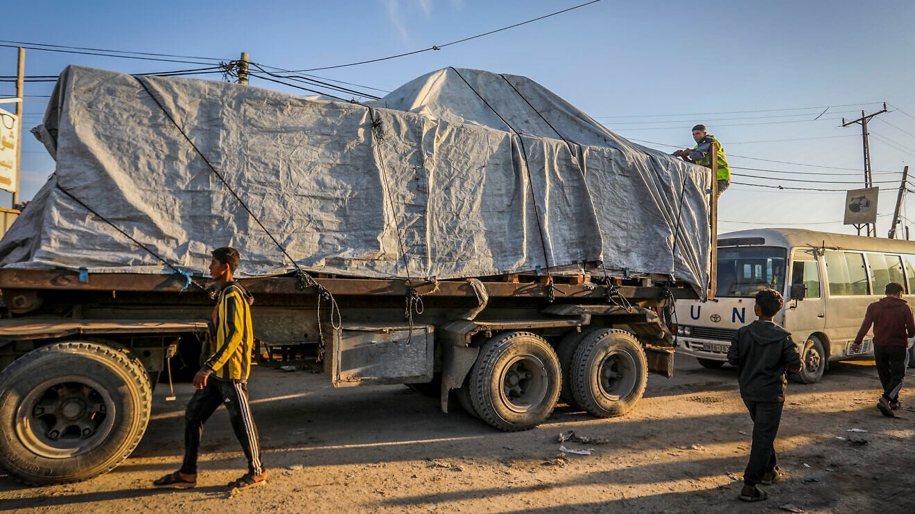 Humanitarian aid and fuel entering Gaza through the Israeli Kerem Shalom border crossing, in Khan Yunis, in the southern Gaza Strip, Nov. 17, 2025. Photo by Abed Rahim Khatib/Flash90.