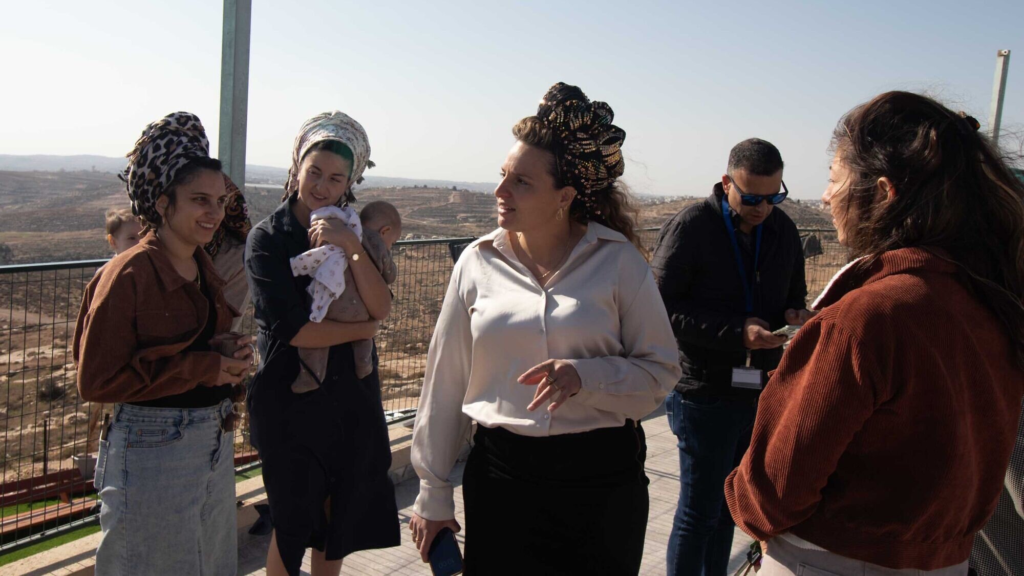 Tzofia Lichtenstein with other women from the new settlement of Mitzpe Ziv in the Hebron Hills speaks to journalists, Nov. 27, 2025. Photo by David Isaac.
