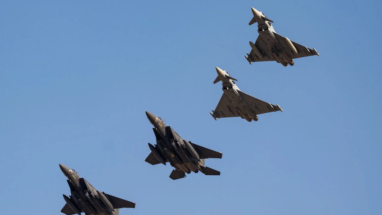Two U.S. Air Force F-15E Strike Eagles and two Kuwaiti Eurofighter Typhoons fly a four-ship formation during exercise Marauder Shield 26.1 within the U.S. Central Command area of responsibility, Nov. 11, 2025. Credit: Staff Sgt. Tylin Rust/U.S. Central Command.