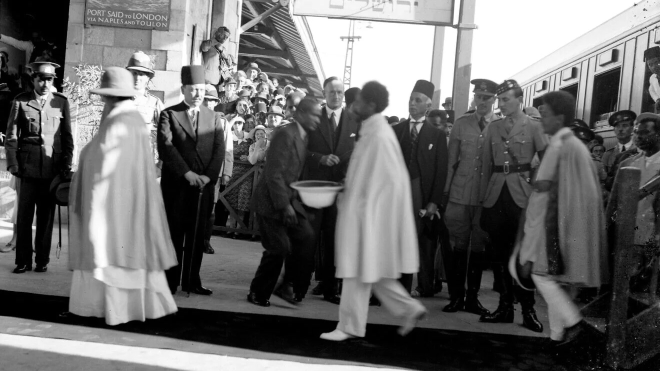 Haile Selassie, emperor of Ethiopia (center), at a Jerusalem railroad station in May 1936. Credit: Matson (G. Eric and Edith) Photograph Collection at the U.S. Library of Congress via Wikimedia Commons.
