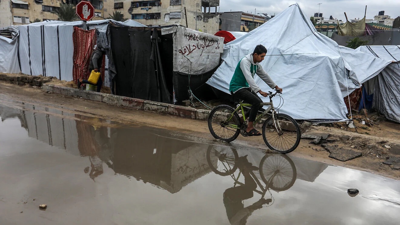 Palestinians near tents in Khan Yunis, in the southern Gaza Strip, Jan. 2, 2026. Photo by Abed Rahim Khatib/Flash90.