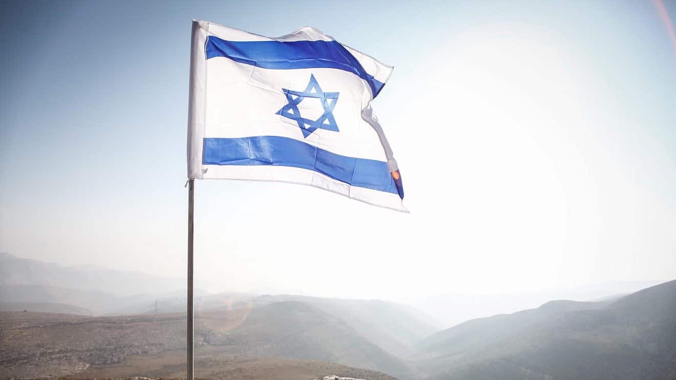 An Israeli flag in the Jordan Valley, near the community of Ma'ale Efraim, Jan. 2, 2014. Photo by Uri Lenz/Flash90.