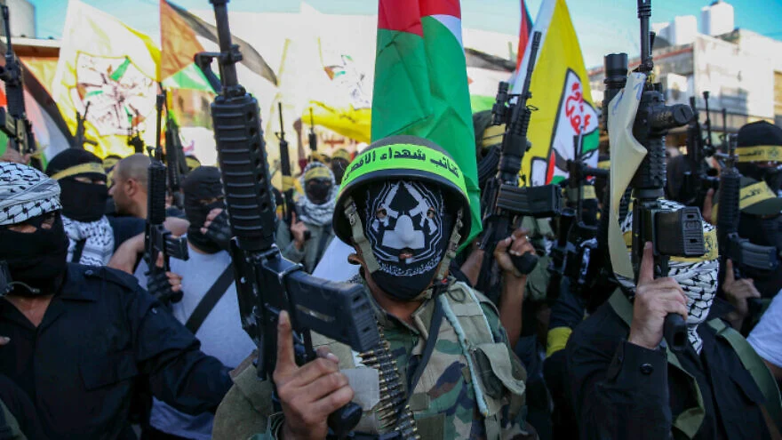 Terrorists from Fatah’s Al-Aqsa Martyrs Brigades rally in support of Palestinian Authority head Mahmoud Abbas near Hebron, June 27, 2021. Photo by Wissam Hashlamoun/Flash90.