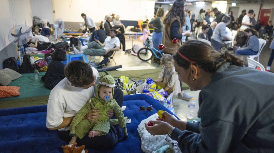 People seek shelter in an underground parking garage in Tel Aviv after air raid sirens sounded, March 3, 2026. Photo: Chaim Goldberg/Flash90