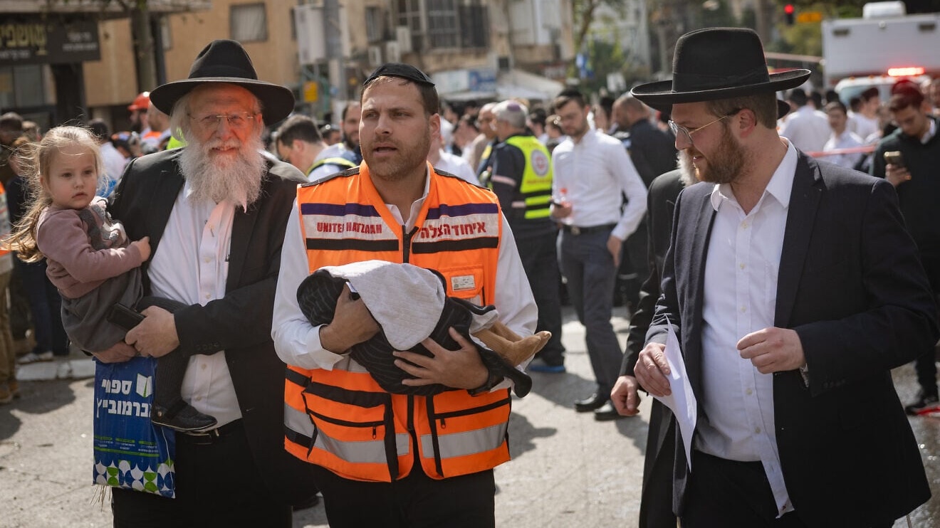 Israeli security and rescue personnel inspect the damage from an Iranian missile in Bnei Brak, east of northern Tel Aviv, March 15, 2026. Photo by Chaim Goldberg/Flash90.