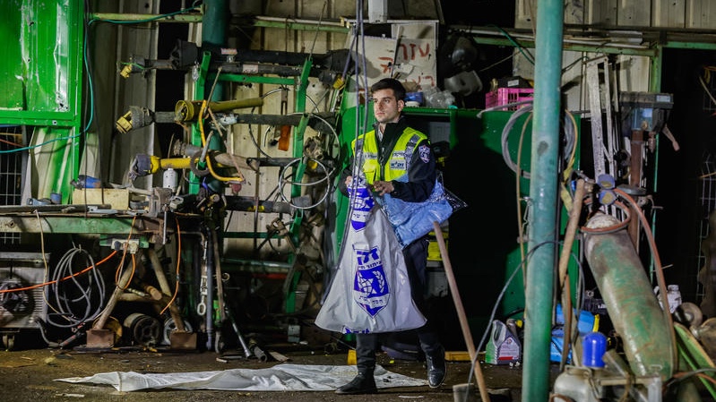 Israeli security and rescue forces at the scene where a missile fired from Iran struck and killed one person in Moshav Adanim, central Israel, March 19, 2026. Photo by Tal Gal/Flash90