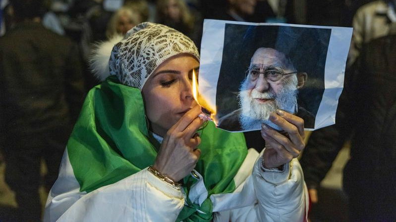 Members of the Iranian Jewish community in Israel burn a picture of Iran’s Supreme Leader Ali Khamenei during a demonstration in support of the Iranian people in the city of Holon, central Israel, January 14, 2026. Photo by Chaim Goldberg/Flash90