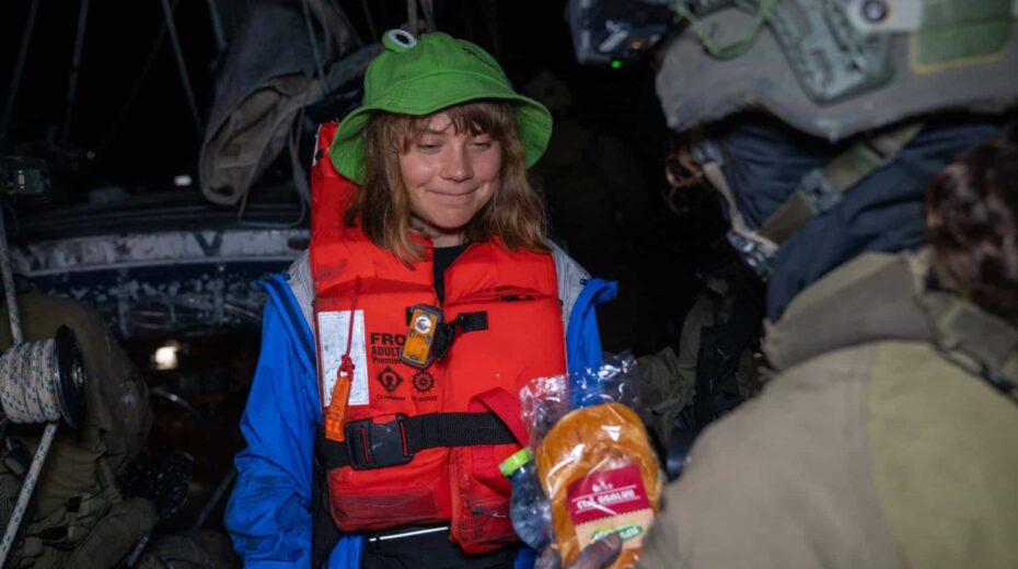 An Israeli soldier offers food and water to activist Greta Thunberg aboard an intercepted Gaza-bound yacht on June 9, 2025. Credit: Israel Foreign Ministry.