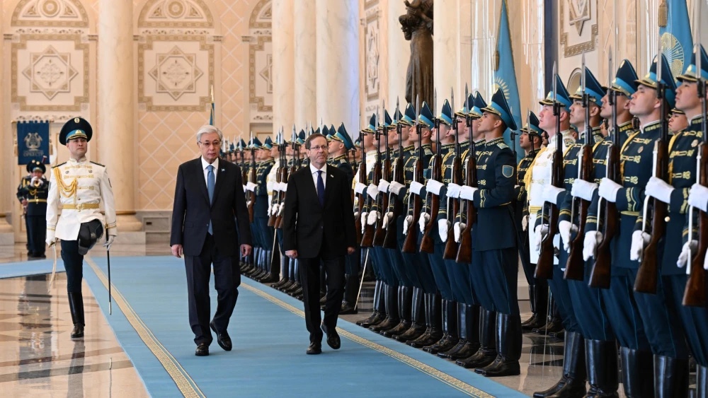 Kazakhstan’s president, Kassym-Jomart Tokayev, second from left, walks with his Israeli counterpart Isaac Herzog at the presidential residence in Astana, Kazakhstan on April 27, 2026. Photo by Haim Zach/GPO.