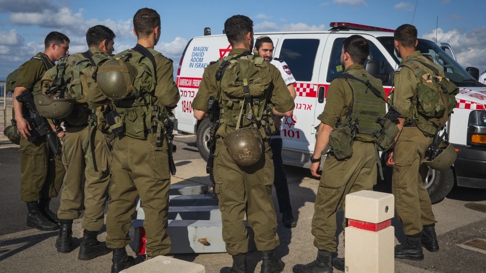 Israeli soldiers and rescue forces wait for the arrival of a helicopter carrying a wounded soldier from Lebanon to Rambam Health Care Campus in Haifa, April 12, 2026. Photo by Sharon Leibel/Flash90.