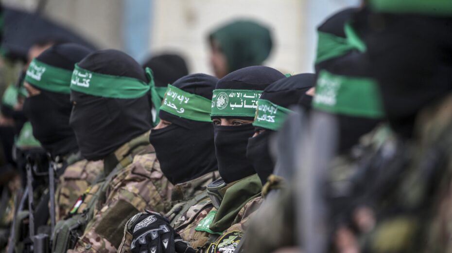Hamas terrorists gather at the site of the handover of Israeli hostages at the Nuseirat camp in the central Gaza Strip as part of the seventh hostage and prisoner release on February 22, 2025. Photo: EPA/MOHAMMED SABER