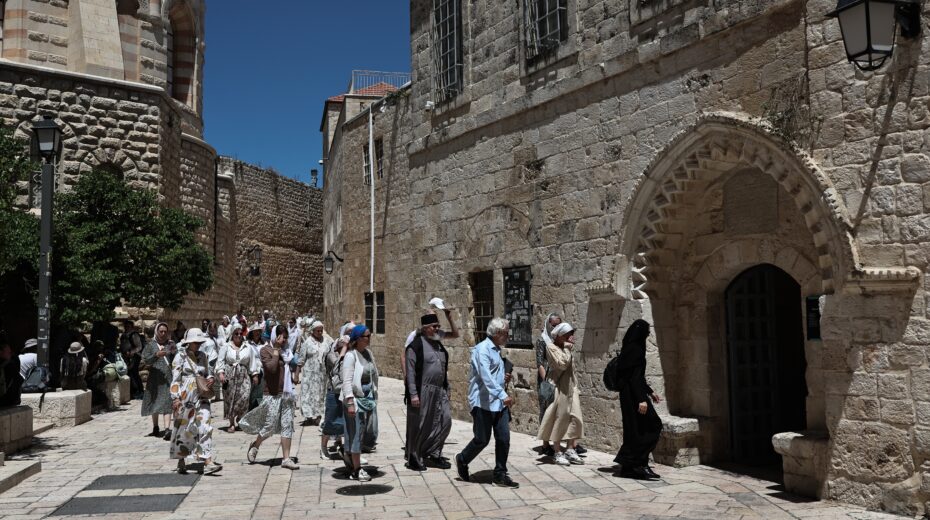 A nun with a group of visitors near Jerusalem's Old City. Following an attack on a French nun, Israeli police are investigating a suspected religiously motivated assault. Photo: EPA/Atef Safadi