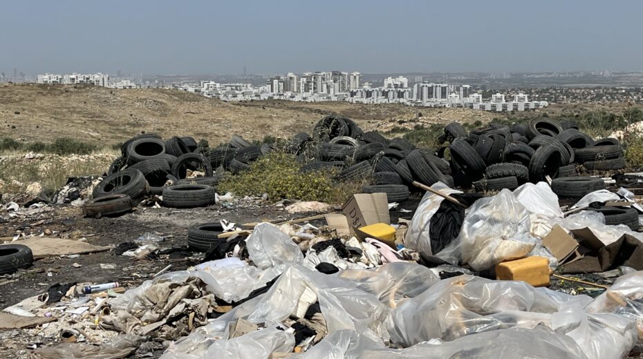 An illegal landfill in western Samaria, overlooking the Israeli city of Rosh HaAyin, May 14, 2026. Photo: Josh Hasten.