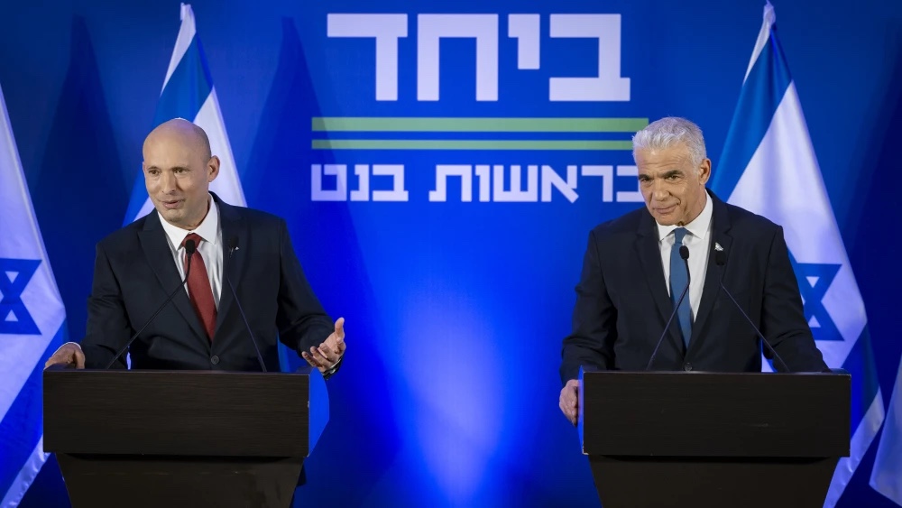 Former Prime Ministers Naftali Bennett (left) and Yair Lapid and hold a press conference in Herzliya announcing their joint list named “Together” ahead of upcoming elections, April 26, 2026. Photo by Chaim Goldberg/Flash90.
