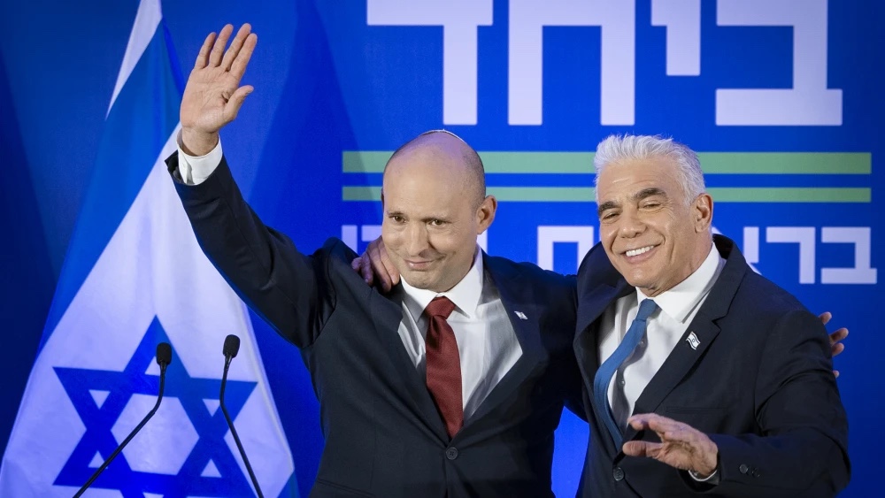 Naftali Bennett (left) and Yair Lapid hold a press conference announcing a joint list named “Together” ahead of upcoming elections, Herzliya, April 26, 2026. Photo by Chaim Goldberg/Flash90.