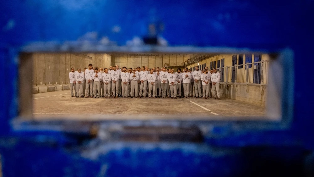 Israel Prison Service officers prepare Palestinian prisoners for release as part of a hostage deal between Israel and Hamas, at Ktzi’ot Prison in southern Israel, Feb. 26, 2025. File photo by Chaim Goldberg/Flash90.