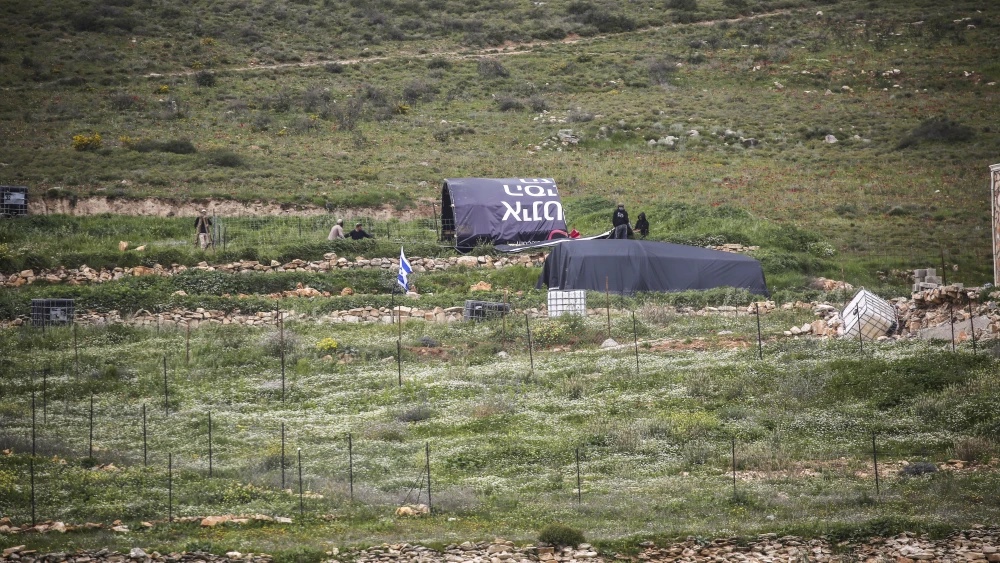 Palestinians throw stones at Jewish settlers as they establish a pastoral outpost at the site where Jewish settler Shmuel Sherman was murdered, in the village of Beit Mirin north of Nablus in Samaria. Photo by Nasser Ishtayeh/Flash90