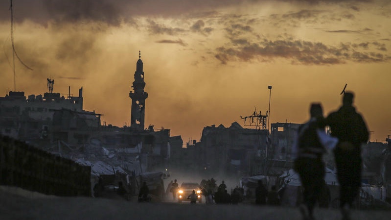 Displaced Palestinians are seen near their tents at sunset in Gaza City, February 12, 2026. Photo by Ali Hassan/Flash90