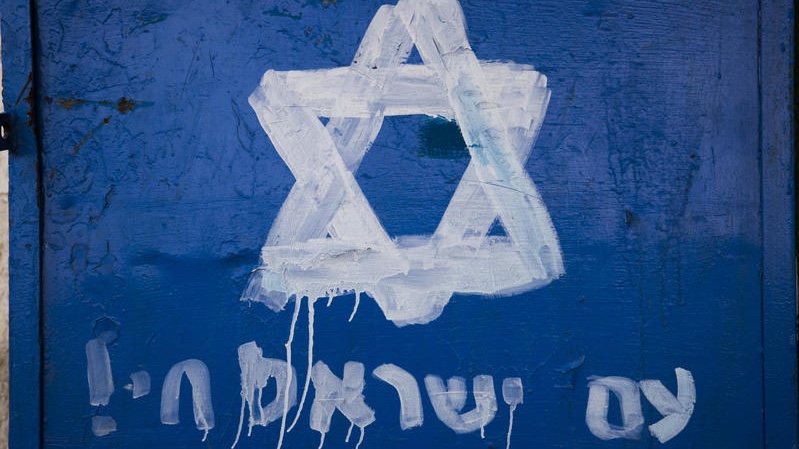 A star of david is painted on a door with the words "The people of Israel live" in Lifta, Jerusalem. Photo by Nati Shohat/Flash90