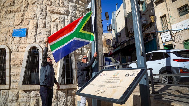 Bethlehem Municipality employees raise a South African flag as a sign of appreciation for their lawsuit against Israel to the International Court of Justice (ICJ), in the West Bank city of Bethlehem, January 16, 2024. Photo by Wisam Hashlamoun/Flash90