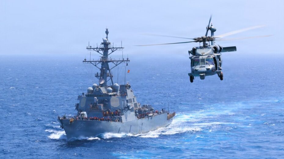 The US destroyer USS Donald Cook (DDG 75) sails alongside an MH-60S Sea Hawk in the Arabian Sea. US forces are continuing their increased naval presence in connection with ongoing operations against Iran. Photo: US Central Command (CENTCOM).